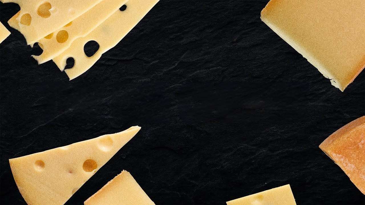 sliced cheese on a black background